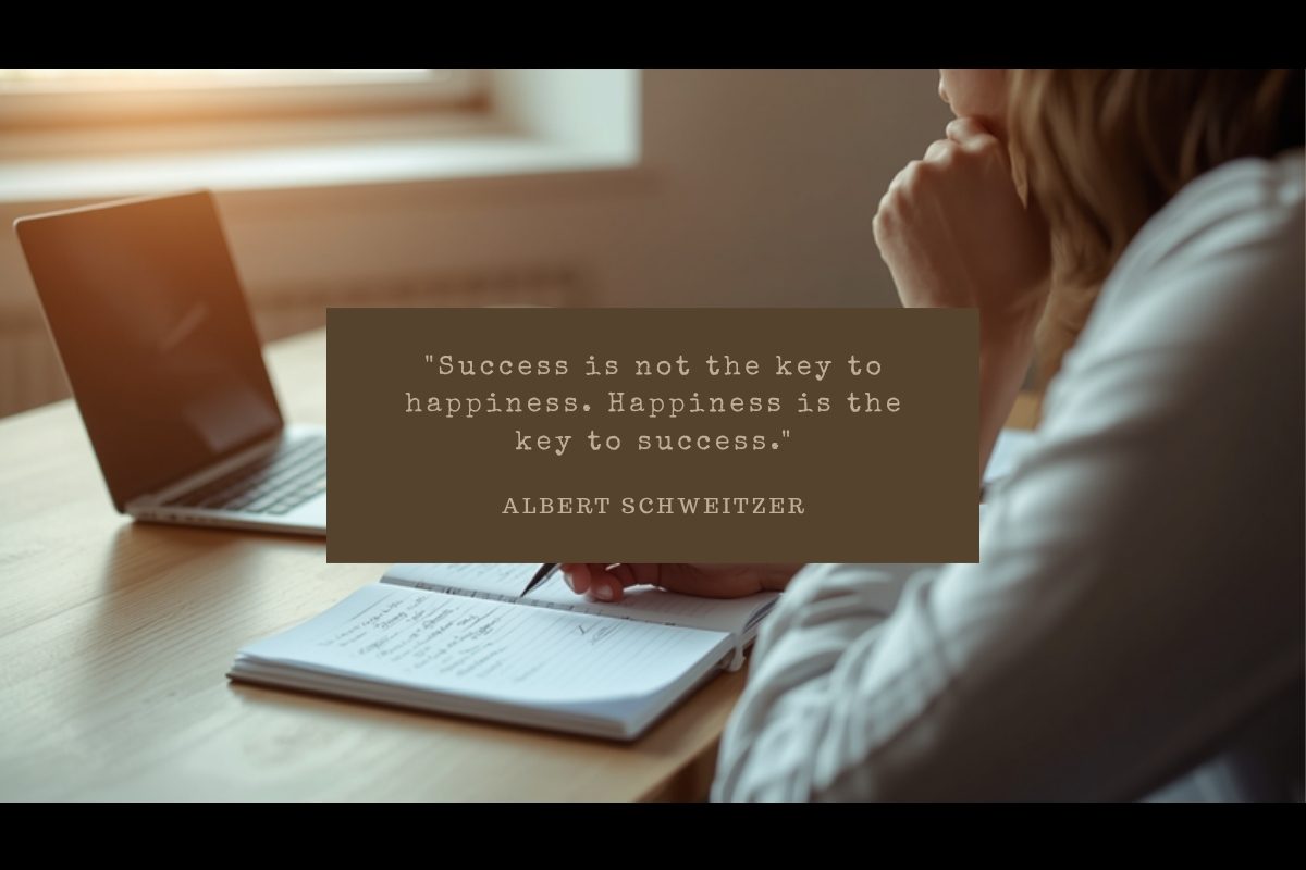 Small business owner pausing thoughtfully at a desk with an open notebook and laptop in afternoon light